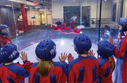 iFLY group watching indoor skydiving